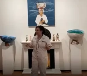 Artist Gilly Lugo pictured with her body of work.