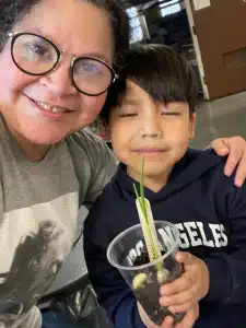 Gilly Lugo with a student during an Urban Gardening workshop